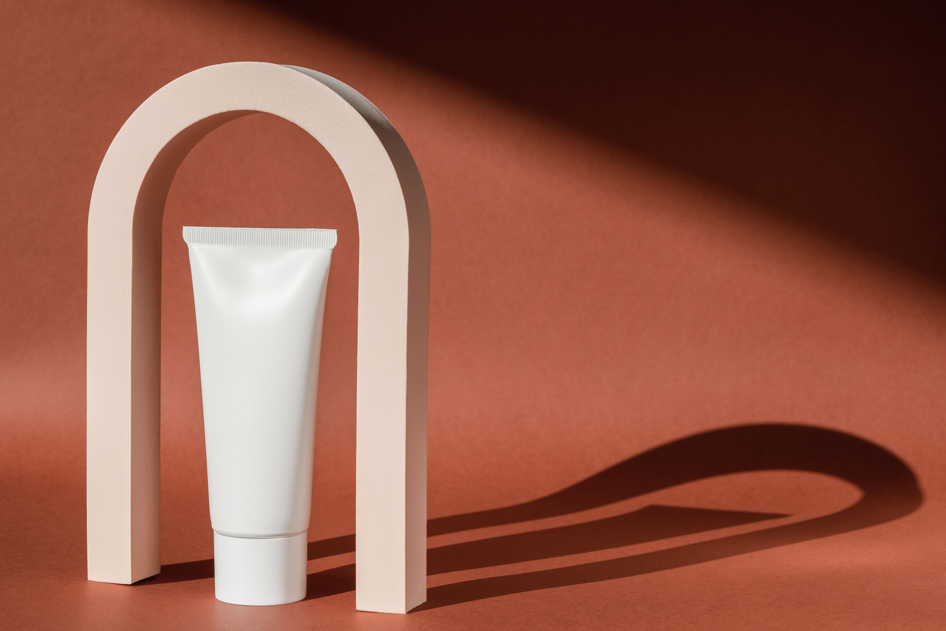 Cream skincare cosmetic art deco arch podium display pedestal stand. Fashion geometric arch for product presentation, lotion, moisturizer. Minimal template. Vintage scene mockup cosmetics